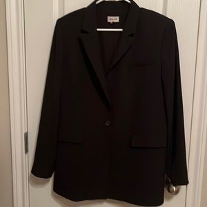 longline blazer cut in a boxy one-button fit
